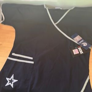 Dallas cowboy scrub top with star on the pockets and tags $30